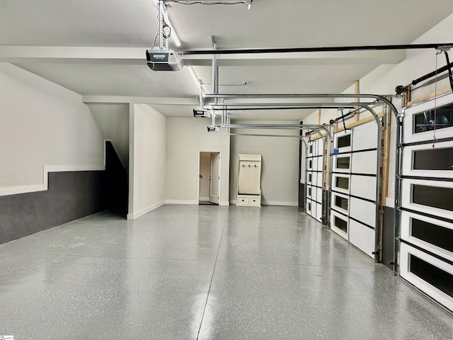 garage featuring baseboards and a garage door opener