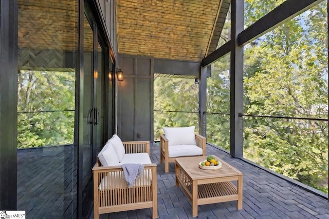 sunroom with a healthy amount of sunlight and an outdoor living space