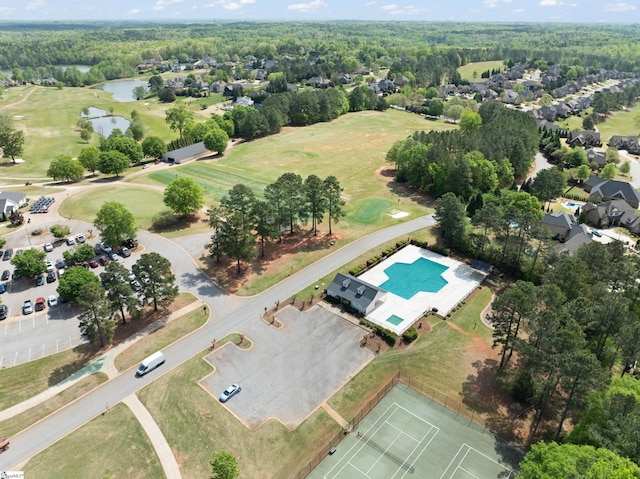 birds eye view of property with a water view, a forest view, and golf course view