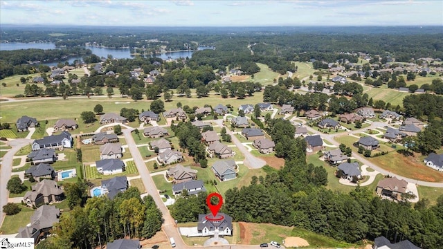 bird's eye view with a water view and a residential view