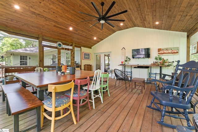 dining space featuring a ceiling fan, wood ceiling, vaulted ceiling, and hardwood / wood-style floors