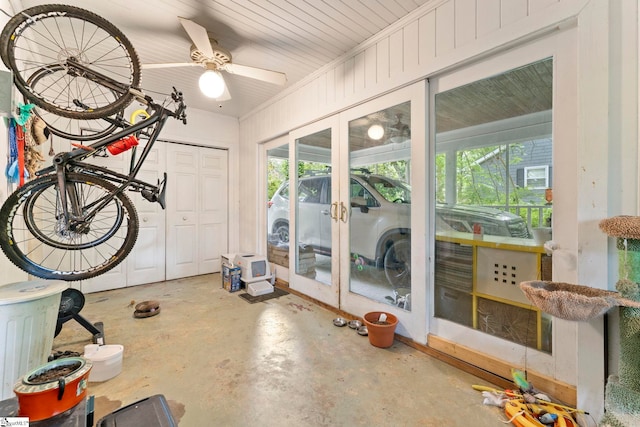 unfurnished sunroom featuring a healthy amount of sunlight and ceiling fan