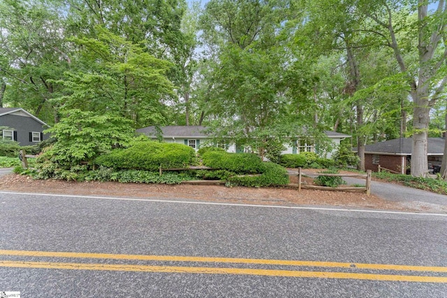 view of front of home featuring fence