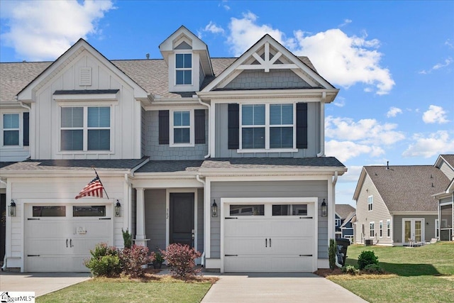view of front facade featuring a garage, board and batten siding, and driveway