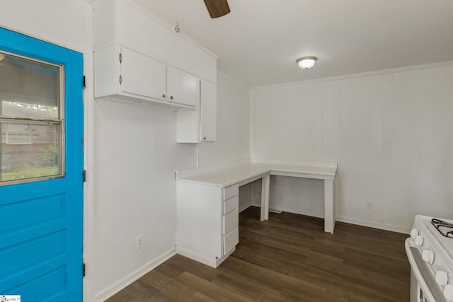 unfurnished office with dark wood-style flooring, baseboards, and a ceiling fan