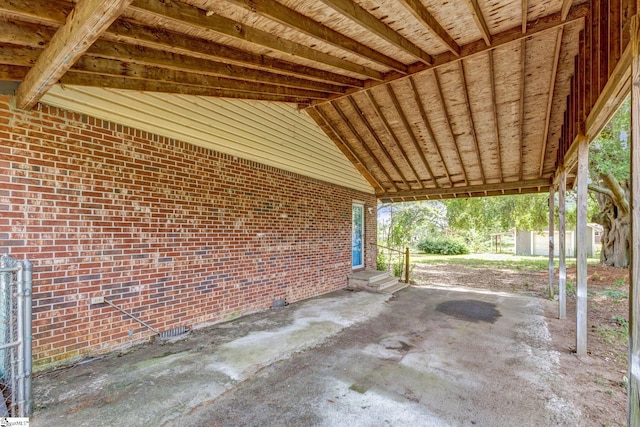 view of patio / terrace featuring entry steps and a carport
