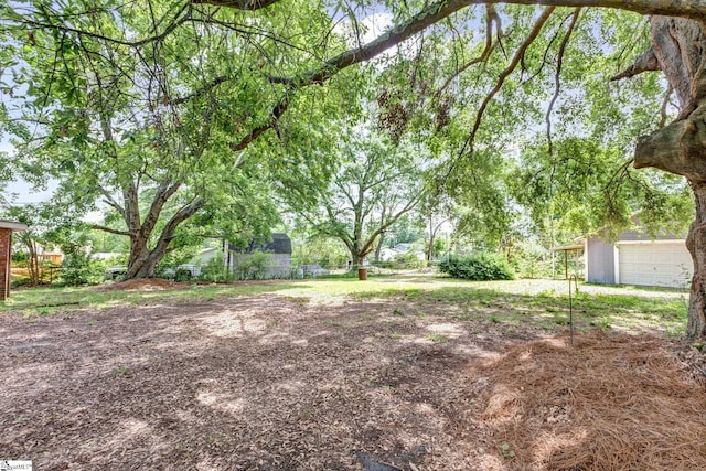 view of yard featuring a garage