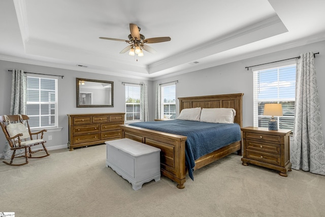 bedroom with a raised ceiling, ornamental molding, and light carpet