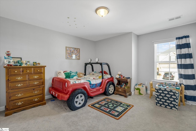 bedroom with visible vents, carpet flooring, and baseboards