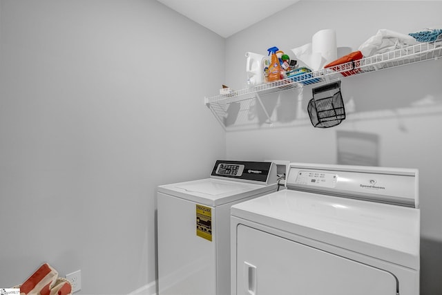 clothes washing area with laundry area and washing machine and clothes dryer