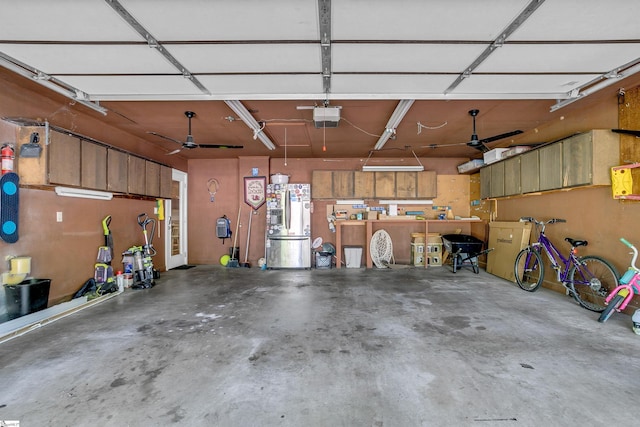 garage featuring stainless steel fridge and a garage door opener