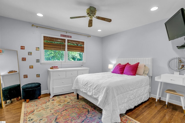 bedroom with recessed lighting, baseboards, and wood finished floors