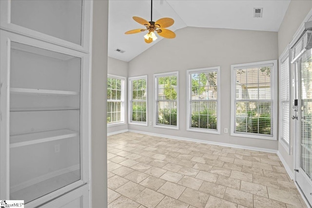 unfurnished sunroom featuring lofted ceiling, baseboards, and visible vents