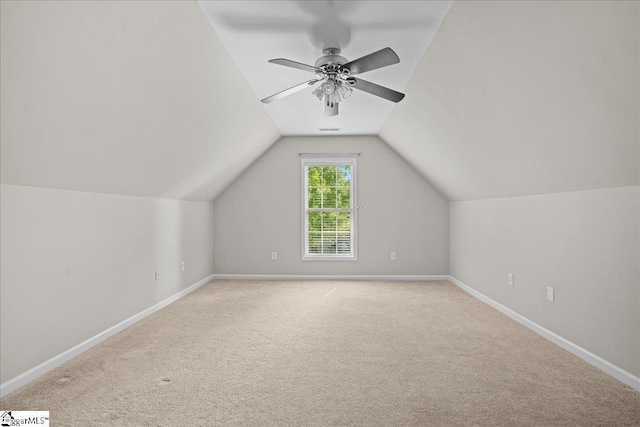 additional living space featuring carpet flooring and baseboards