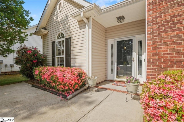 doorway to property with a patio