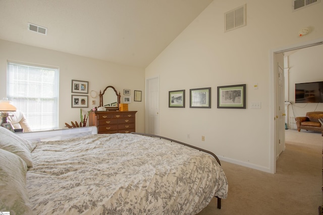 carpeted bedroom with baseboards, visible vents, and high vaulted ceiling