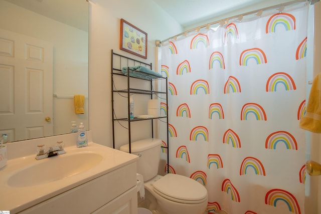 full bathroom with vanity, toilet, and a shower with shower curtain