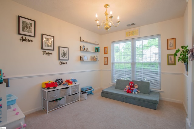 recreation room featuring carpet flooring, a notable chandelier, baseboards, and visible vents