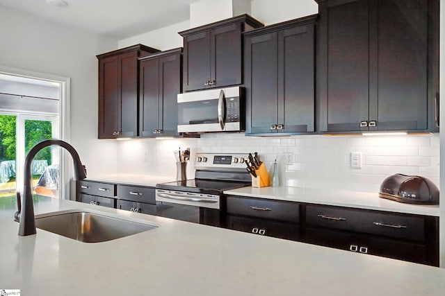 562 New Cut Meadows Rd, Inman, SC 29349 - kitchen with a sink, stainless steel appliances, light countertops, and decorative backsplash