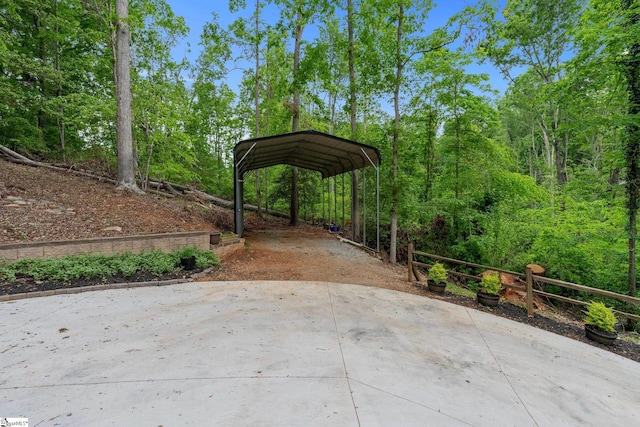 view of patio / terrace featuring a carport and driveway