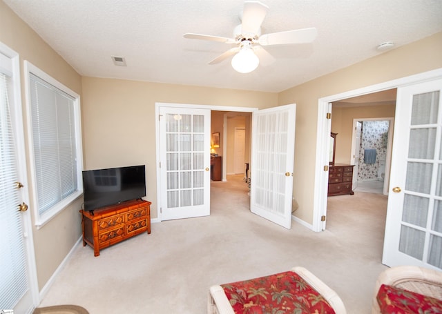 unfurnished room featuring baseboards, carpet floors, french doors, and visible vents