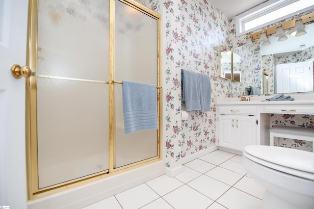 full bath featuring a stall shower, wallpapered walls, baseboards, toilet, and tile patterned floors