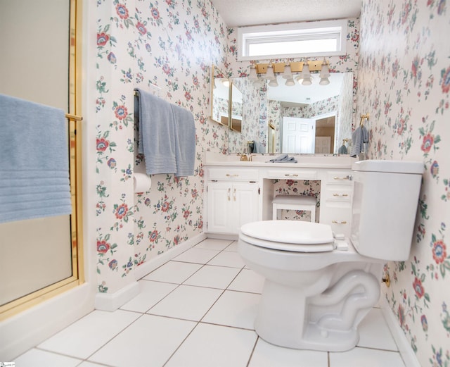 full bathroom featuring an enclosed shower, toilet, wallpapered walls, baseboards, and vanity