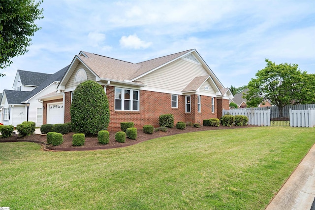 view of property exterior featuring a garage, fence, a lawn, brick siding, and roof with shingles