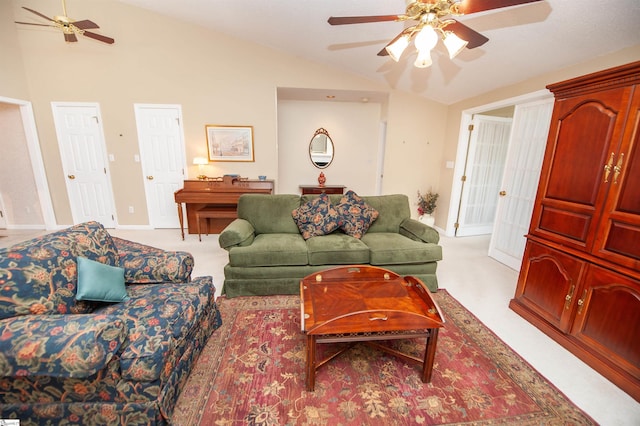 living room with baseboards, ceiling fan, carpet, and vaulted ceiling
