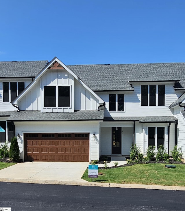 317 Breakwater Ln, Seneca, SC 29678 - modern farmhouse with driveway, board and batten siding, a garage, a front lawn, and a shingled roof