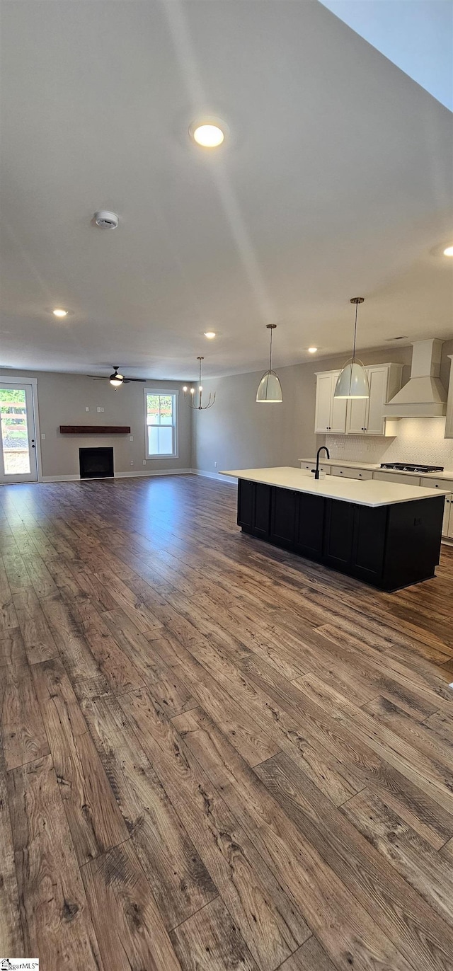 317 Breakwater Ln, Seneca, SC 29678 - unfurnished living room with dark wood-style floors, recessed lighting, baseboards, and a fireplace