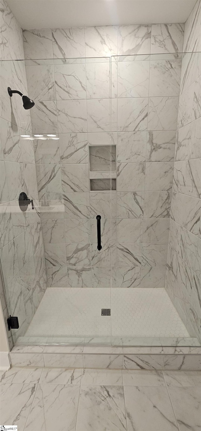 317 Breakwater Ln, Seneca, SC 29678 - full bath featuring a shower stall and marble look tile flooring