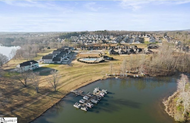 drone / aerial view featuring a water view and a residential view