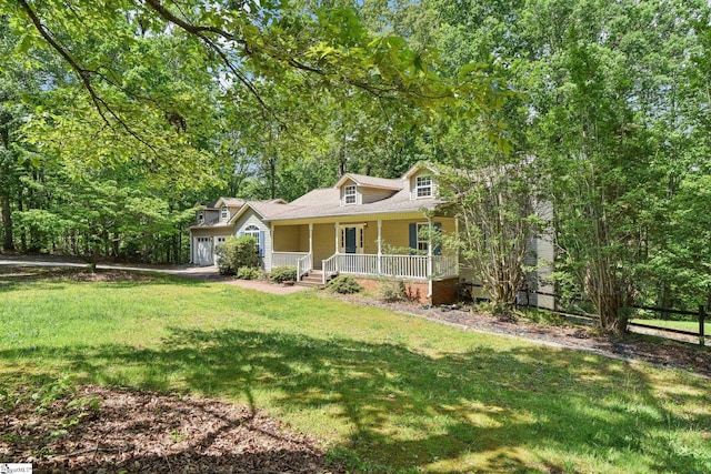 cape cod house featuring covered porch, fence, a garage, and a front yard