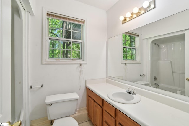 full bathroom featuring vanity, toilet, and tub / shower combination