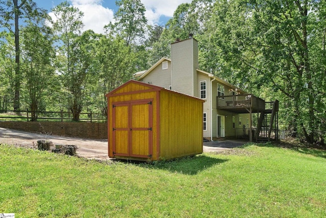 view of shed with fence