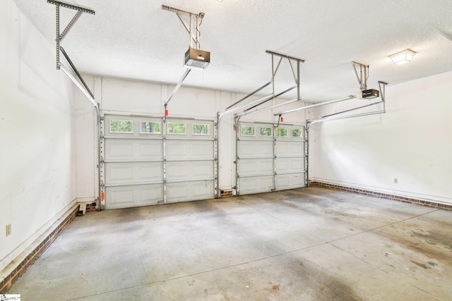 garage featuring baseboards and a garage door opener