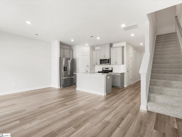 112 Arrow Ct, Greer, SC 29651 - kitchen featuring stainless steel appliances, light wood-style floors, open floor plan, light countertops, and recessed lighting