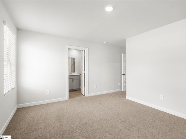 112 Arrow Ct, Greer, SC 29651 - unfurnished bedroom with light carpet, connected bathroom, and recessed lighting