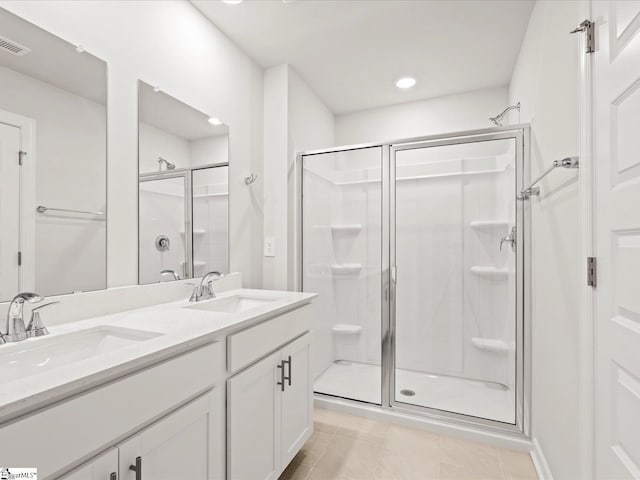 122 Arrow Ct, Greer, SC 29651 - bathroom featuring a shower stall, double vanity, tile patterned flooring, and recessed lighting