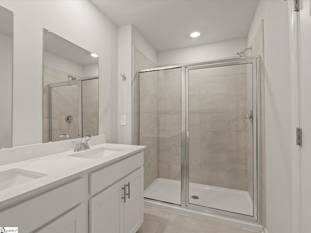 124 Arrow Ct, Greer, SC 29651 - full bath featuring a shower stall, double vanity, recessed lighting, and tile patterned flooring