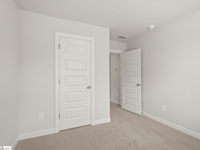 124 Arrow Ct, Greer, SC 29651 - unfurnished bedroom featuring light colored carpet and baseboards