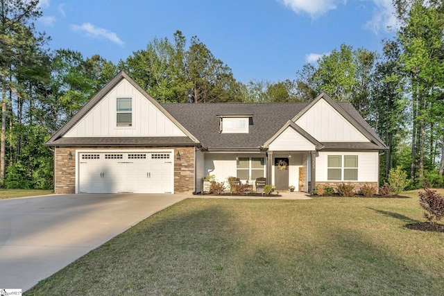 555 Canewood Ln, Campobello, SC 29322 - view of front of house featuring stone siding, board and batten siding, driveway, and a front yard