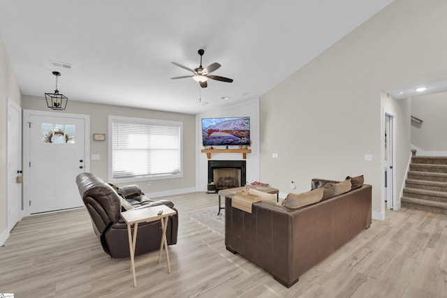 555 Canewood Ln, Campobello, SC 29322 - living room featuring light wood-type flooring, stairway, a fireplace, and visible vents
