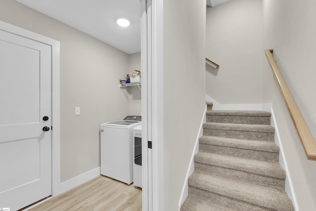 555 Canewood Ln, Campobello, SC 29322 - stairs featuring baseboards, washer and dryer, and wood finished floors
