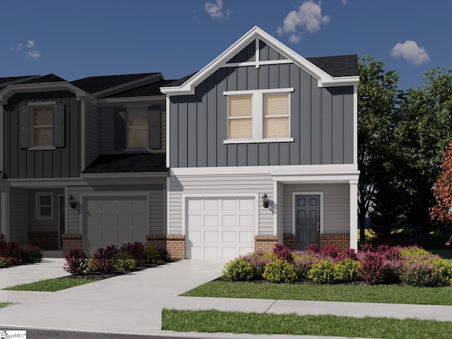 view of front of home with concrete driveway, a garage, brick siding, and board and batten siding