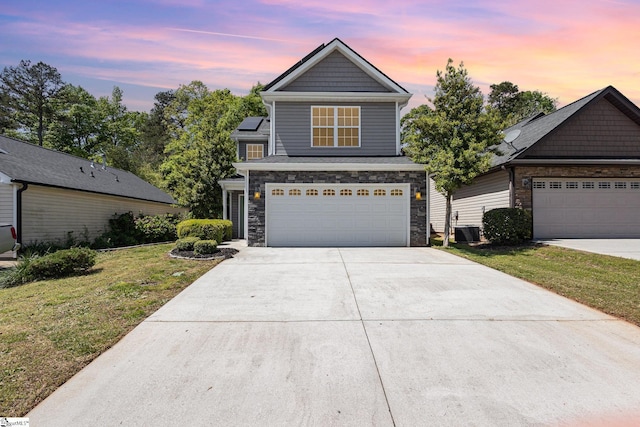 301 Glenlea Ln, Greenville, SC 29617 - traditional home with an attached garage, stone siding, concrete driveway, a front lawn, and cooling unit