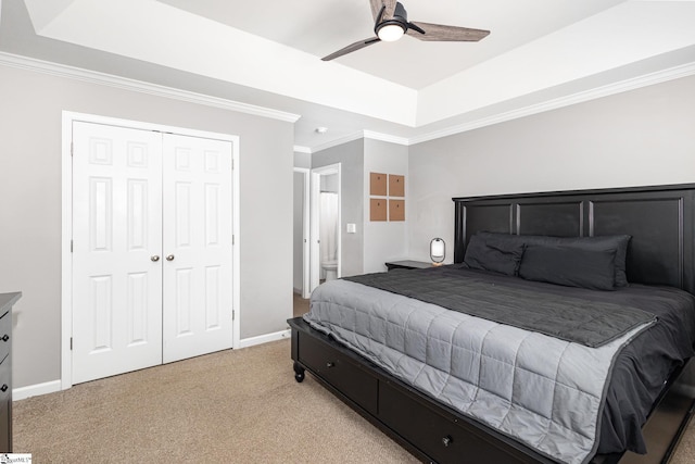 301 Glenlea Ln, Greenville, SC 29617 - bedroom featuring a closet, ornamental molding, light carpet, a tray ceiling, and baseboards