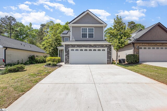 301 Glenlea Ln, Greenville, SC 29617 - view of front of property featuring stone siding, driveway, a garage, a front lawn, and cooling unit