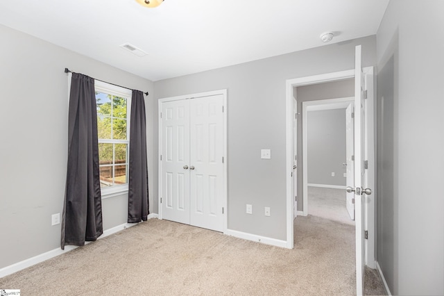 301 Glenlea Ln, Greenville, SC 29617 - unfurnished bedroom featuring carpet flooring, baseboards, a closet, and visible vents